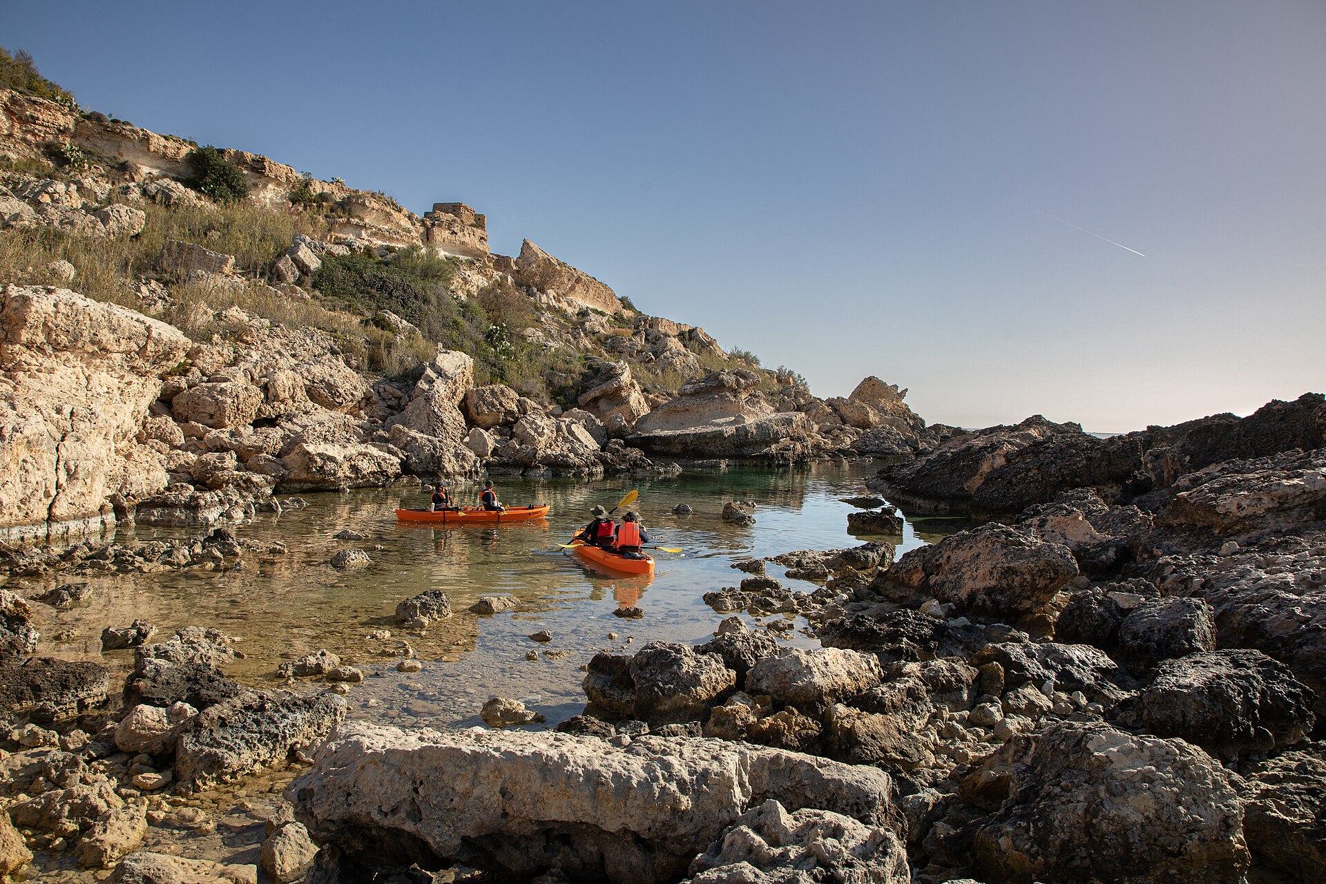 The small rocky inlet at Slugs Bay below Selmun, with rock pools along both arms