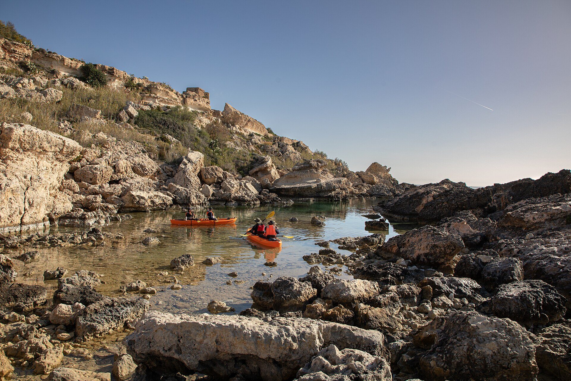 The small rocky inlet at Slugs Bay below Selmun, with rock pools along both arms